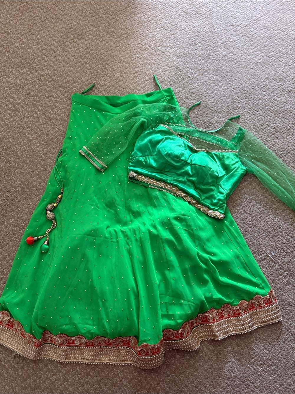 Green Traditional Lehenga Choli. In good condition but the blouse has some wear.